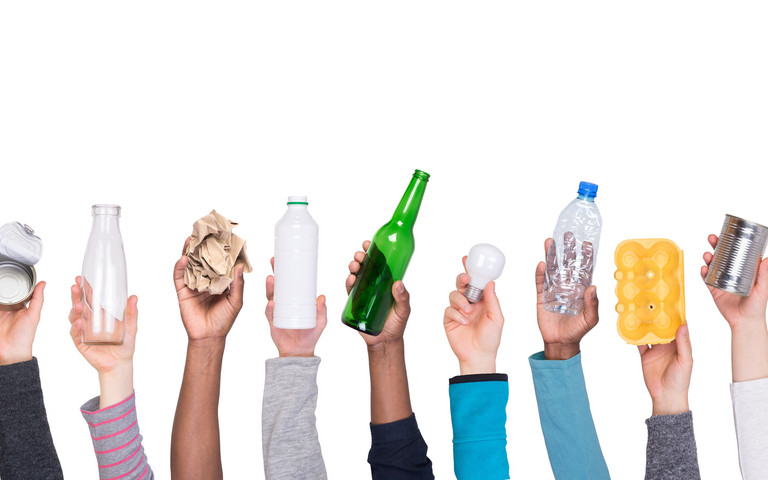 Hands holding up different sorts of waste. Photo: photka - stock.adobe.com